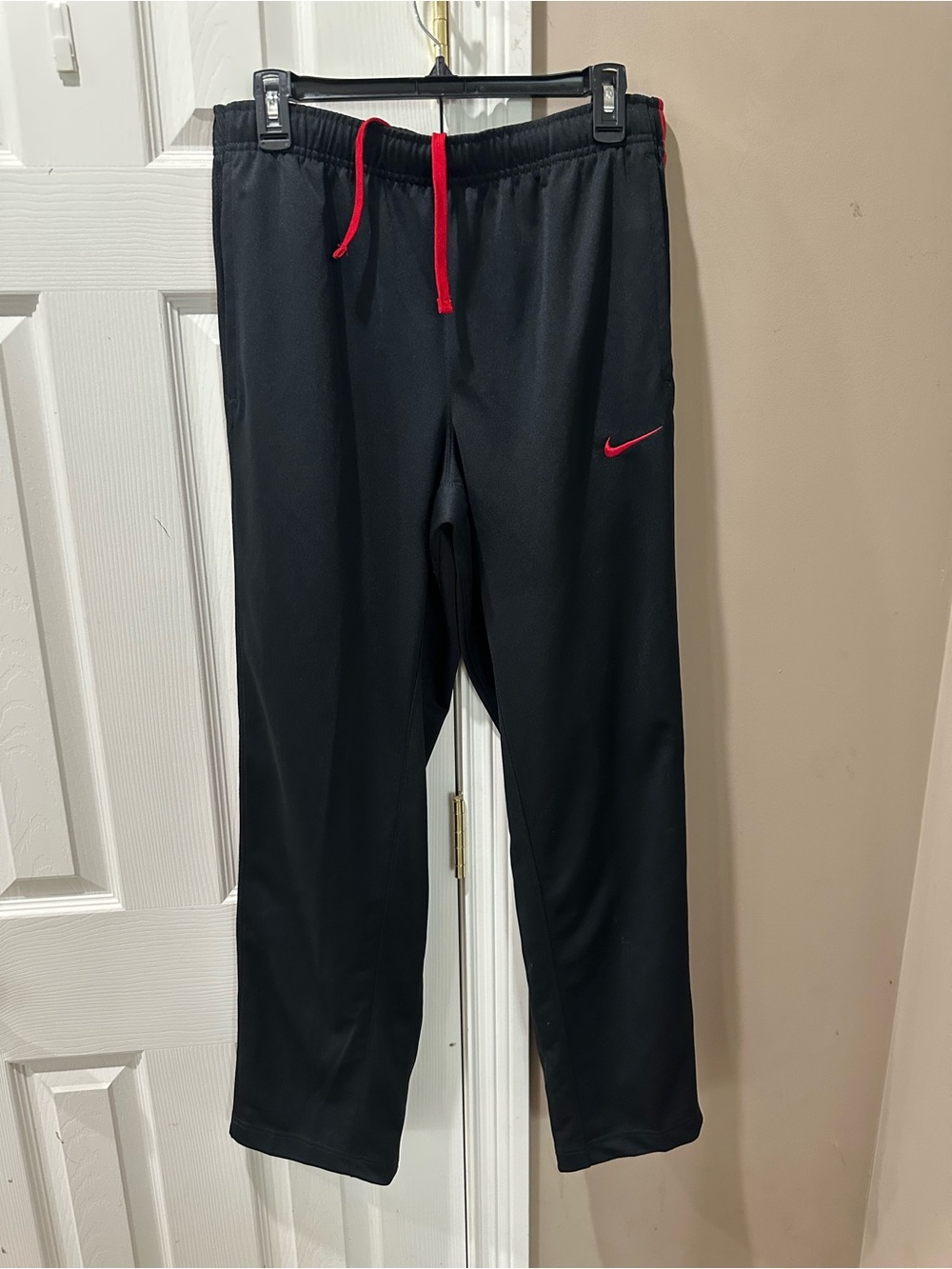 Nike Black Track Pants with Red Drawstring and Swoosh